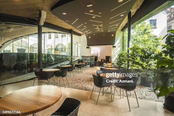 local restaurant with modern glass wall - garden brunch stock pictures, royalty-free photos & images