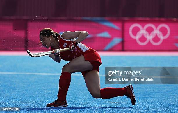 Ai Murakami of Japan shoots to score the winning the golden goal from a penalty in extra time during the Women's Hockey classification match between...