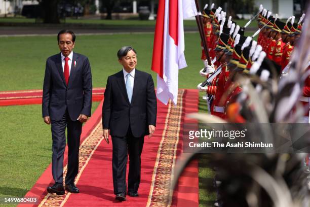 Emperor Naruhito reviews the honour guard with Indonesian President Joko Widodo at Bogor Palace on June 19, 2023 in Bogor, Indonesia.