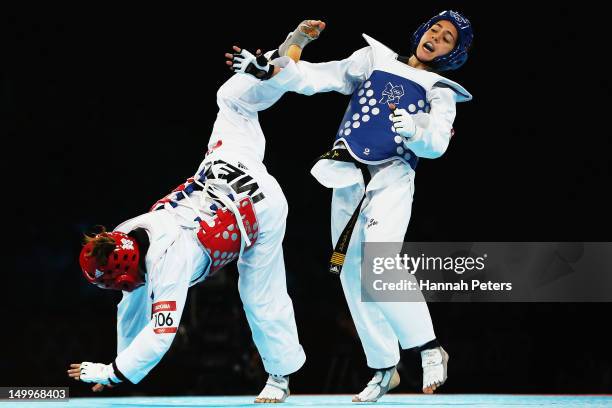 Raya Hatahet of Jordan competes against Jannet Alegria Pena of Mexico during the Women -49kg Preliminary Round Taekwondo on Day 12 of the London 2012...