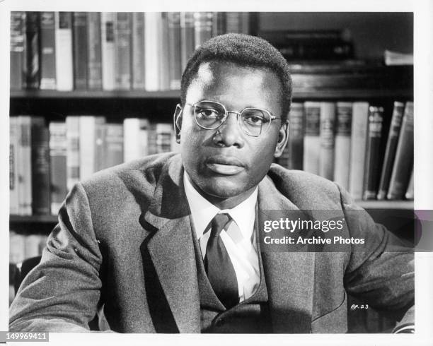 Sidney Poitier at desk in a scene from the film 'Pressure Point', 1962.