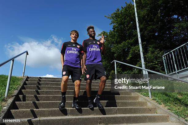 Andrey Arshavin and Alex Song of Arsenal before a training session at the Arsenal training camp on August 8, 2012 in Hennef, Germany.