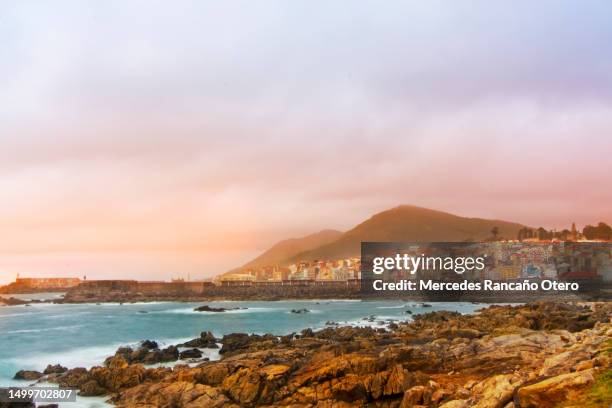 a guarda fishing village and harbor, santa tegra mountain sunset background, pontevedra province, galicia, spain. - galicia stock pictures, royalty-free photos & images