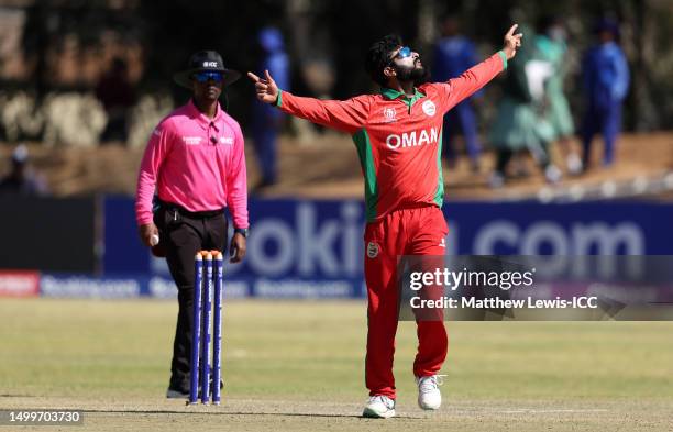 Jay Odedra of Oman celebrates the wicket of Harry Tector of Ireland during the ICC Men's Cricket World Cup Qualifier Zimbabwe 2023 match between...