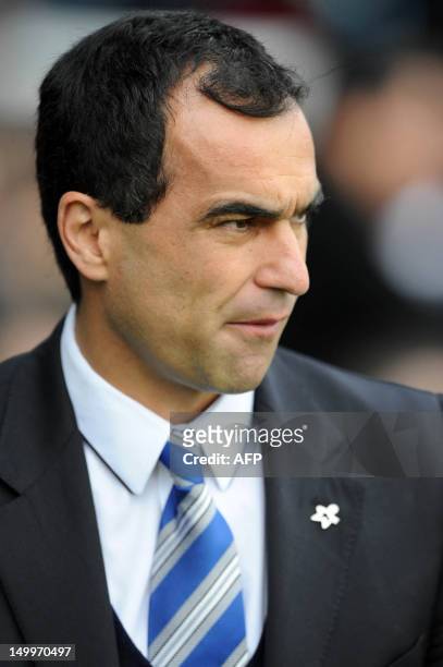 Wigan Athletic's Spanish manager Roberto Martinez looks on before the English Premier League football match between Fulham and Wigan Athletic at...