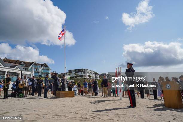 The Armed Forces Day flag is raised on Gyllygvase Beach during the ceremony to mark the start of 2023 Armed Forces Week, on June 19, 2023 in...