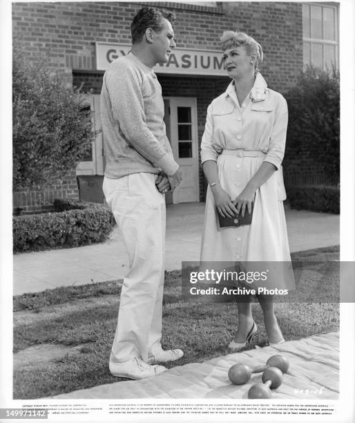Robert Rockwell and Eve Arden outside school gymnasium in a scene from the film 'Our Miss Brooks', 1956.