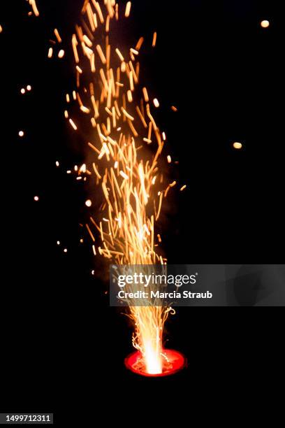 vibrant red sparks against a black background - sparks fly stock pictures, royalty-free photos & images