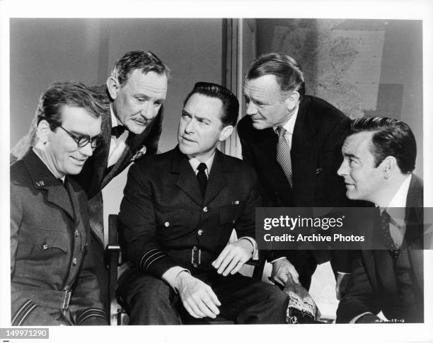 John Fraser, Trevor Howard, Richard Todd, John Mills, and Richard Johnson from part of a committee appointed by Winston Churchill to investigate the...