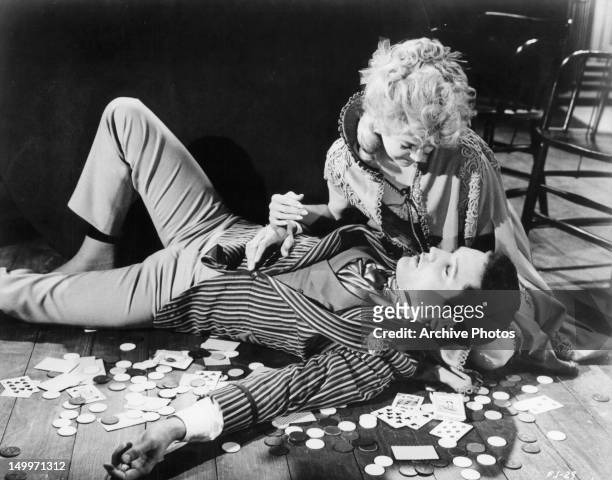 Elvis Presley is cradled by Donna Douglas on the floor in a scene from the film 'Frankie And Johnny', 1966.