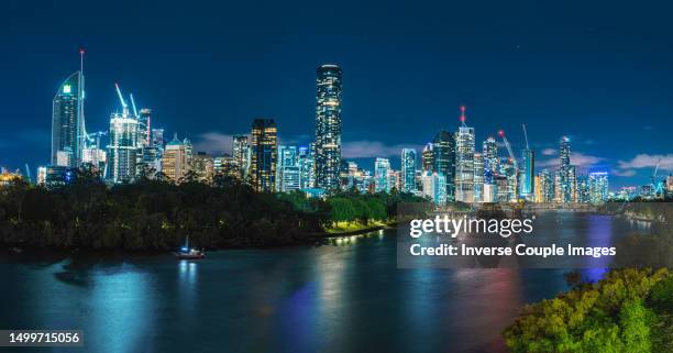 panorama scene of brisbane cityscape and modern office building over brisbane river at twilight time in central business district or call cbd, queensland, australia - brisbane cityscape stock pictures, royalty-free photos & images