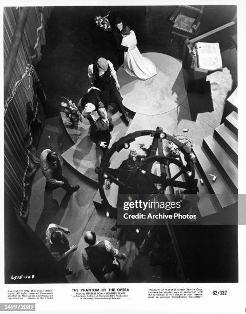 Lighting fixture falls on Herbert Lom in a scene from the film 'The Phantom Of The Opera', 1962.