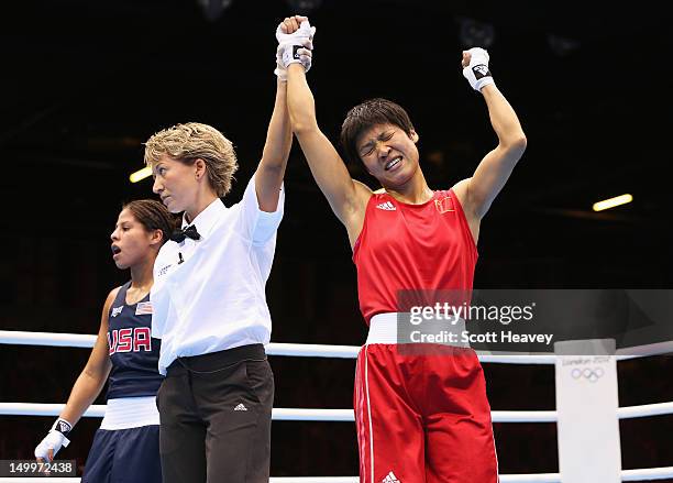 Cancan Ren of China celebrates her victory against Marlen Esparza of the United States during the Women's Fly Boxing on Day 12 of the London 2012...