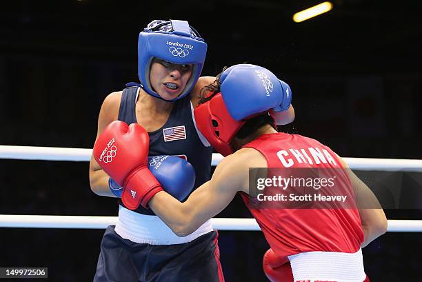 Cancan Ren of China in action with Marlen Esparza of the United States during the Women's Fly Boxing on Day 12 of the London 2012 Olympic Games at...