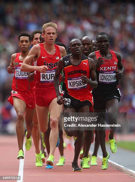 Galen Rupp of the United States, Moses Ndiema Kipsiro of Uganda and Thomas Pkemei Longosiwa of Kenya compete in the Men's 5000m Round 1 Heats on Day...