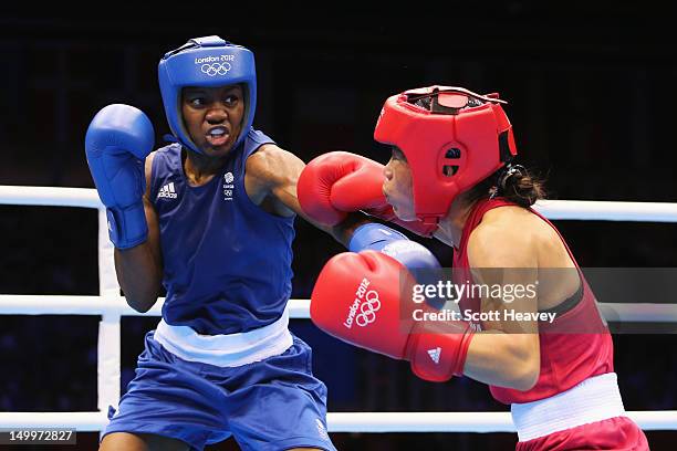 Nicola Adams of Great Britain in action against Chungneijang Mery Kom Hmangte of India during the Women's Fly Boxing semifinals on Day 12 of the...