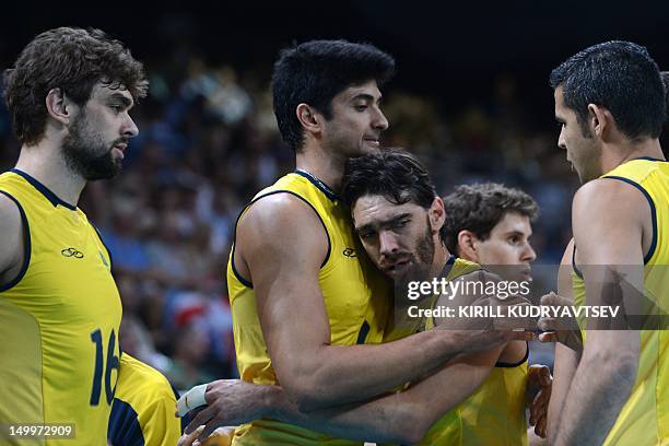 Brazil's Leandro Vissotto Neves and Gilberto Godoy Filho react before the Men's quarterfinal volleyball match between Argentina and Brazil in the...