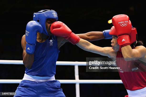 Nicola Adams of Great Britain in action against Chungneijang Mery Kom Hmangte of India during the Women's Fly Boxing semifinals on Day 12 of the...