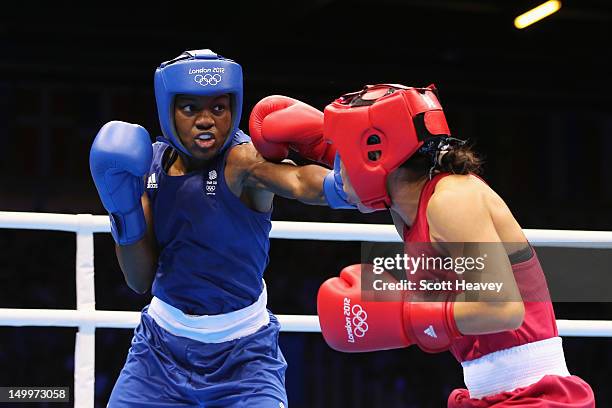 Nicola Adams of Great Britain in action against Chungneijang Mery Kom Hmangte of India during the Women's Fly Boxing semifinals on Day 12 of the...