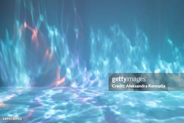 abstract empty underwater 3d stage with colorful dreamy water light waves texture. undersea background with copy space. - stage light 3d stock pictures, royalty-free photos & images