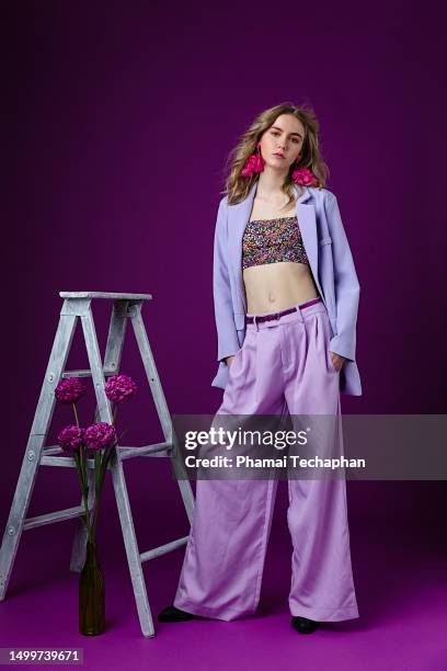 beautiful woman wearing purple suit - wide leg trousers stock pictures, royalty-free photos & images