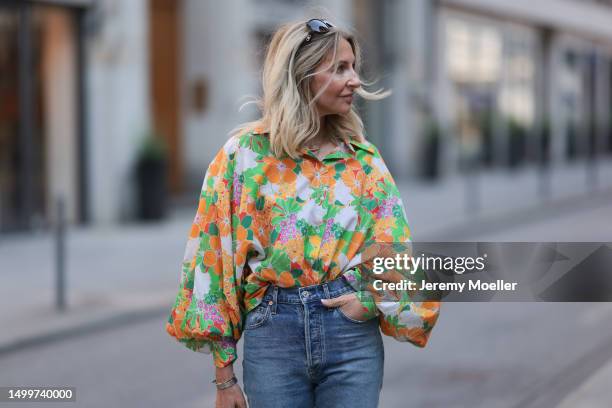 Sue Giers wearing colorful oversized SoSue blouse floral plattern, blue Citizen of Humanity jeans, black Celine shades on June 08, 2023 in Hamburg,...