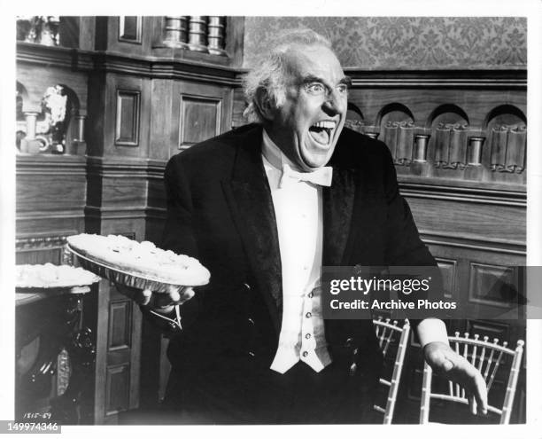 Ed Begley about to throw pie in a scene from the film 'The Unsinkable Molly Brown', 1964.