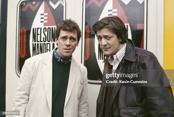 English actors and comedians Stephen Fry and Hugh Laurie, of comedy double act Fry And Laurie, at the Nelson Mandela 70th Birthday Tribute, Wembley...