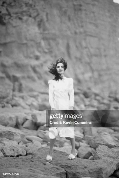 English singer-songwriter and guitarist PJ Harvey on a Dorset beach, January 1995.