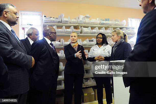 Secretary of State Hillary Clinton with Ambassador Ibrahim Rasool, Health Minister Aaron Motsoaledi and Pharmacist Assistant Palesa Vinger at the...