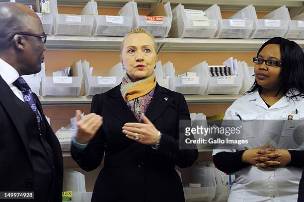 Secretary of State Hillary Clinton with Health Minister Aaron Motsoaledi and Pharmacist Assistant Palesa Vinger at the Delft South Clinic for the...