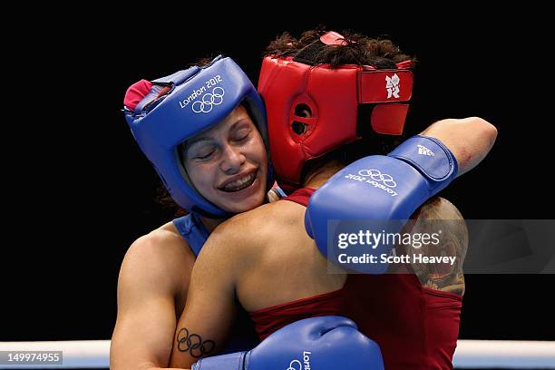 Sofya Ochigava of Russia celebrates her victory against Adriana Araujo of Brazil during the Women's Light Boxing semifinals on Day 12 of the London...