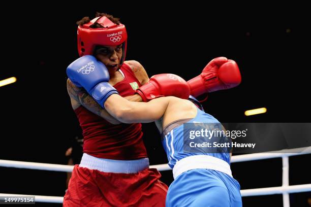 Adriana Araujo of Brazil in action against Sofya Ochigava of Russia during the Women's Light Boxing semifinals on Day 12 of the London 2012 Olympic...