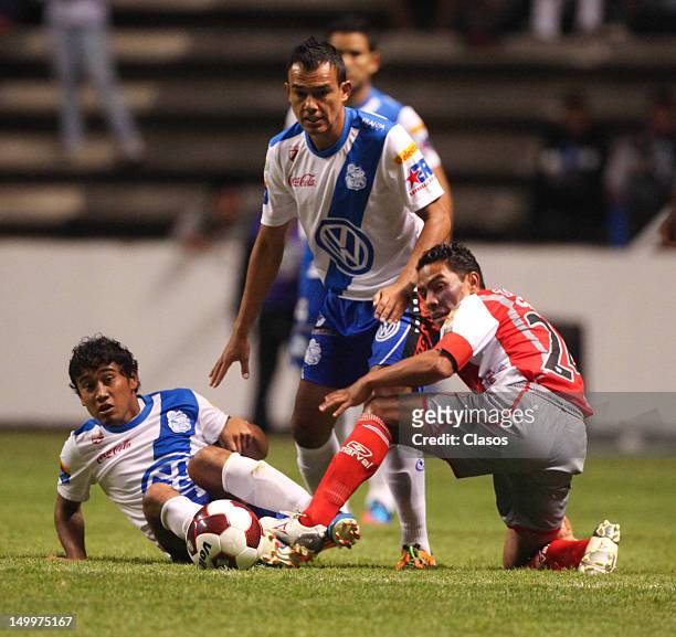 Aldo Polo of Puebla struggle for the ball with Jose Cruzalta of Lobos during a match between Puebla and Lobos BUAP as part of the Copa MX 2012 at...