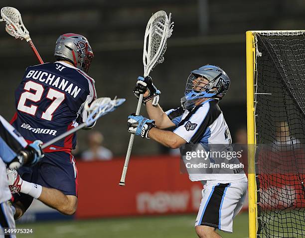 Kevin Buchanan of the Boston Cannons scores against Brian Phipps of the Ohio Machine at Harvard Stadium August 4, 2012 in Boston, Massachusetts.