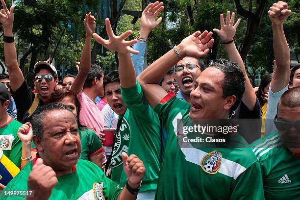 Fans of the Mexican National Team Mexico celebrate the victory over Japan in soccer in the Olympic Games London 2012 at the Glorieta del Angel of...