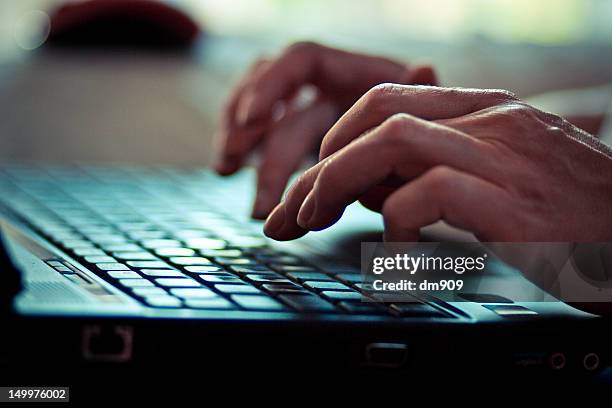 hands - hands using laptop stock pictures, royalty-free photos & images