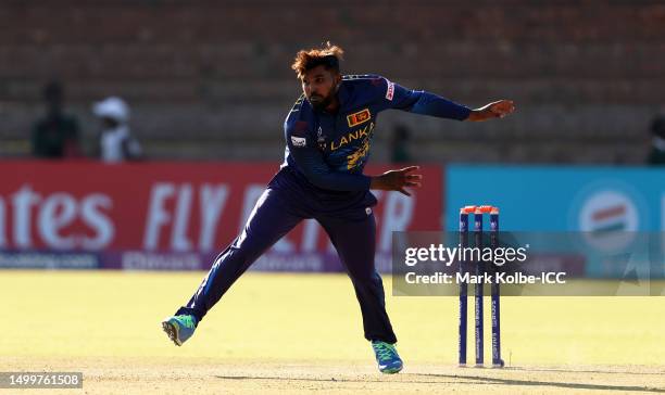 Wanindu Hasaranga of Sri Lanka in bowling action during the ICC Men's Cricket World Cup Qualifier Zimbabwe 2023 match between Sri Lanka and United...