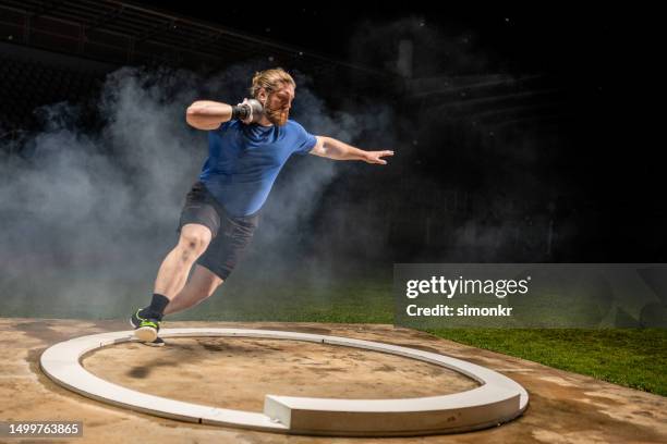 athlete throwing shot put ball - shot put stock pictures, royalty-free photos & images