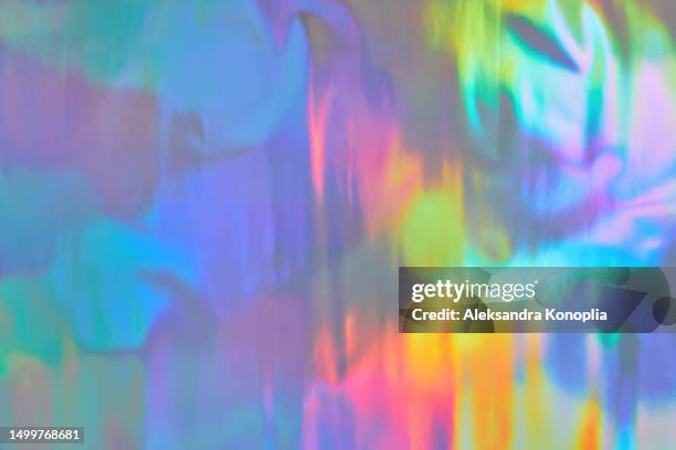 abstract neon blue, purple, green, pink glowing holographic foil texture. futuristic, retro, glowwave, acidwave, 80s, 90s, y2k, disco, rave background. - aura stock pictures, royalty-free photos & images