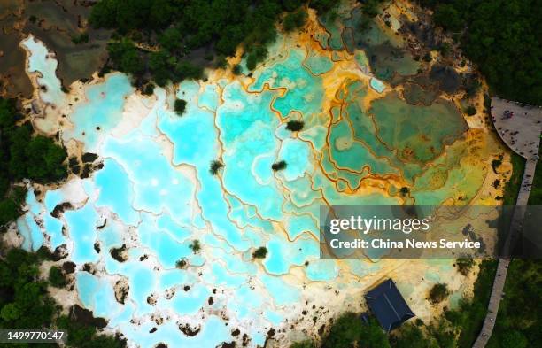 Aerial view of the Huanglong scenic area on June 19, 2023 in Songpan County, Aba Tibetan and Qiang Autonomous Prefecture, Sichuan Province of China....