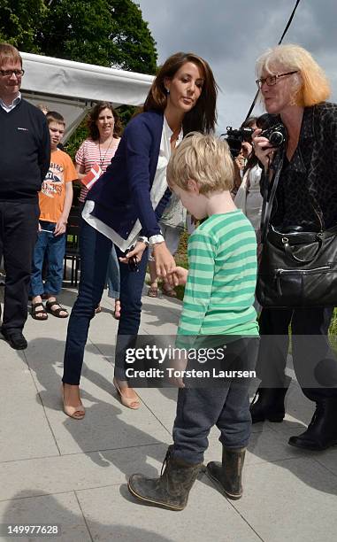 Princess Marie of Denmark visits the National Association Autism Elsinore Holiday Village on August 8, 2012 in Helsingor, Denmark.