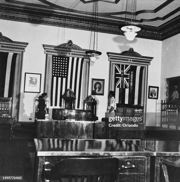 The Senate Chamber, formerly the State Dining Room, with the flags of the United States and of Hawaii, displayed on the wall, in the ʻIolani Palace...