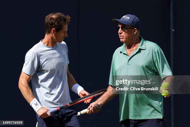 Andy Murray of Great Britain speaks with coach Ivan Lendl on the practice court on Day One of the cinch Championships at The Queen's Club on June 19,...