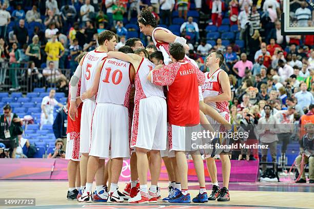 Russia celebrates their 83-74 victory against Lithuania during the Men's Basketball quaterfinal game on Day 12 of the London 2012 Olympic Games at...