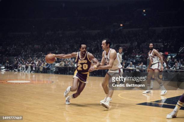 The Los Angeles Lakers' Donnie Freeman is guarded by the New York Knicks' Bill Bradley at Madison Square Garden, New York, October 23rd 1975.