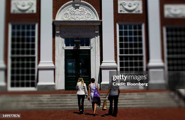 Students enter a building in this photo taken with a tilt shift lens at Harvard University's Business School in Cambridge, Massachusetts, U.S., on...