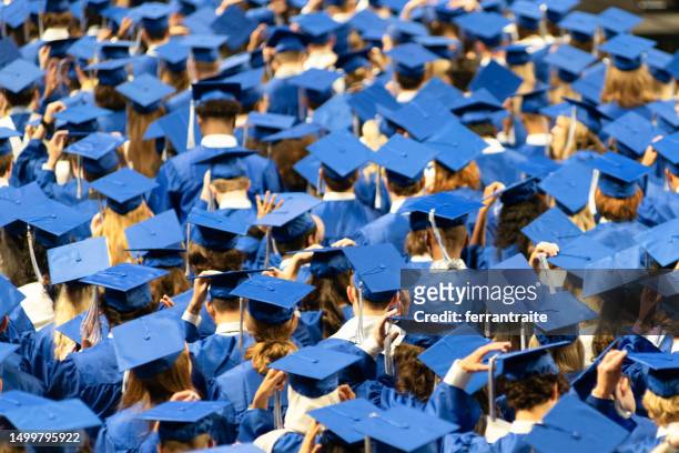 student audience at graduation ceremony - graduation crowd stock pictures, royalty-free photos & images