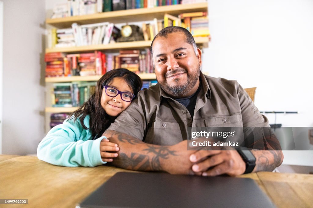 Hispanic Veteran Amputee on Laptop