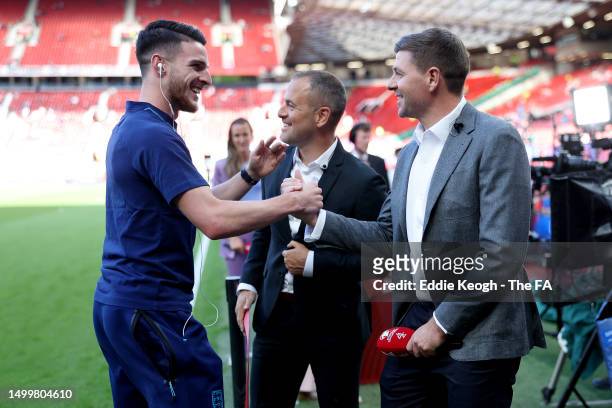 Declan Rice of England talks to former England players Steven Gerrard and Joe Cole prior to the UEFA EURO 2024 qualifying round group C match between...